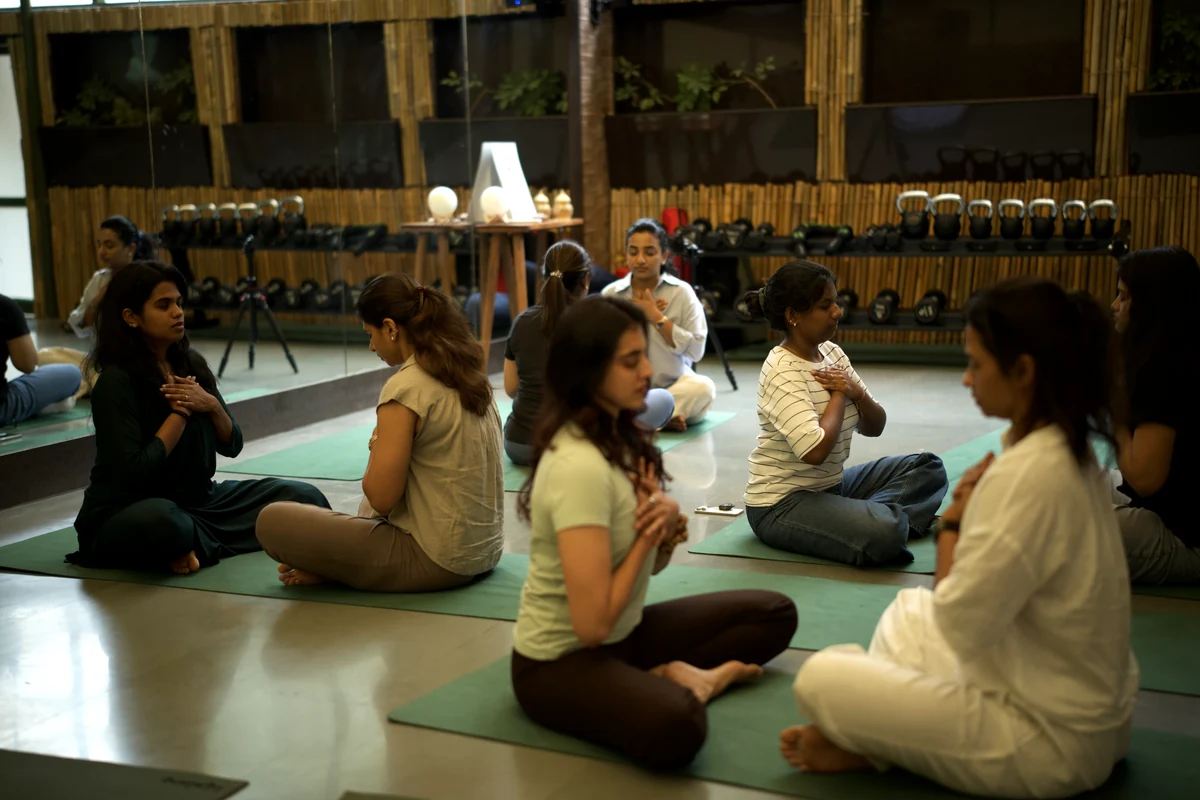 Women seated in pairs connecting at a Sphere gathering